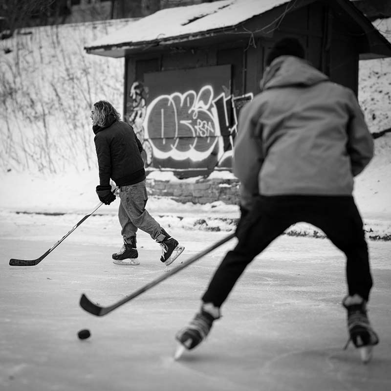 Friendly game of hockey on a frozen lake.
